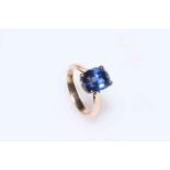 14 carat gold and treated mid blue sapphire ring, size N.