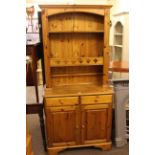 Ducal pine dresser and oval yew coffee table.