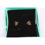 Pair 9 carat gold small heart shaped earrings set with tiny diamonds.