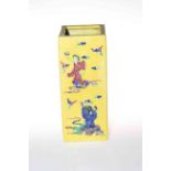 Chinese square section vase, decorated with figures on yellow ground, 28cm.