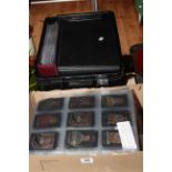 Two boxes holding a collection of American Tobacco Co felt and silk cigarette cards (large to