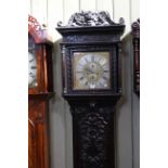 Antique carved oak eight day longcase clock, having square brass dial with silvered chapter ring,