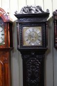 Antique carved oak eight day longcase clock, having square brass dial with silvered chapter ring,