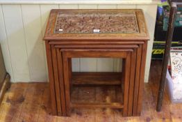Nest of four Asian carved hardwood tables (largest 56cm by 55cm).