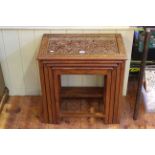 Nest of four Asian carved hardwood tables (largest 56cm by 55cm).