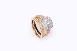 Diamond cluster ring set in 18 carat gold, having centre elevated 0.