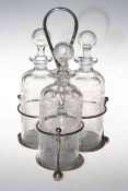 Silver plated three glass bottle tantalus,