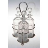 Silver plated three glass bottle tantalus,