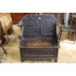 Victorian carved oak box hall bench, 105cm by 92cm.
