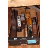 Box of planes and joinery tools.