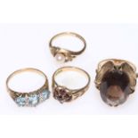 Collection of four 9 carat gold gem set dress rings.