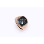 Gents 9 carat gold ring set with engraved haematite intaglio, size R.