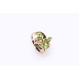 Peridot and diamond ring set in 9 carat gold, size N.