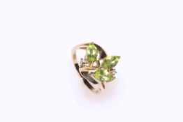 Peridot and diamond ring set in 9 carat gold, size N.