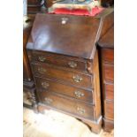 Period style oak four drawer bureau, 102.5cm by 67cm.