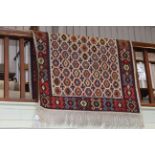 Turkish rug with a beige ground, 2.30 by 1.30.