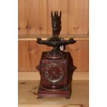 Victorian rouge marble mantel clock, mounted with bronze Aladdin's lamp and cherub, overall 50cm.