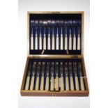 Cased set of a dozen dessert knives and forks.