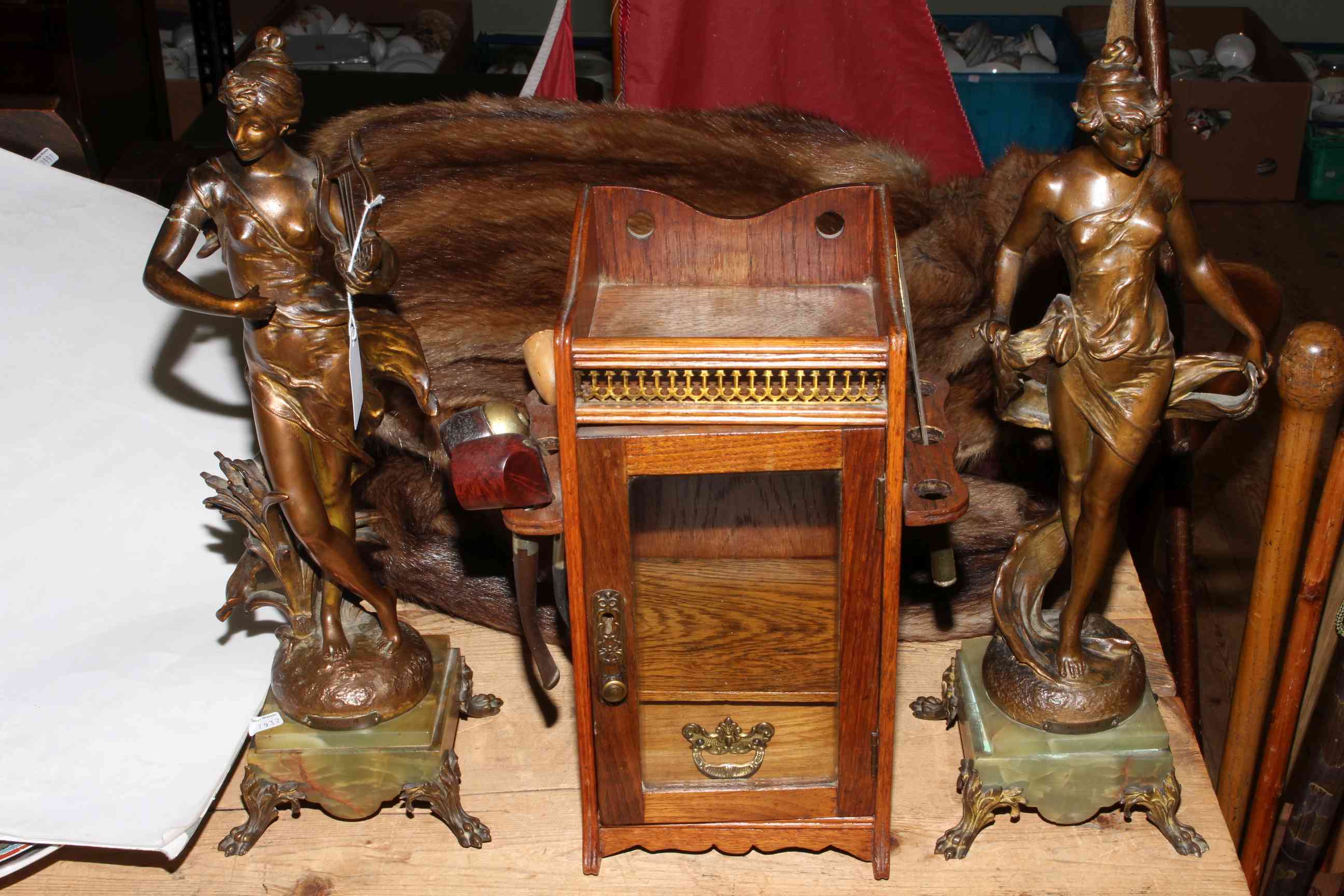 Pair of spelter ladies, smokers cabinet, two fur coats and a pond yacht.