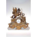 Victorian ornate gilt metal mantel clock having equestrian hunter with hounds and wild boar,