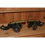 Pair of cast metal and brass model table cannons.