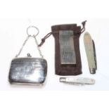 Dunhill lighter, small silver purse, Birmingham 1915 and two silver and mother of pearl penknives.