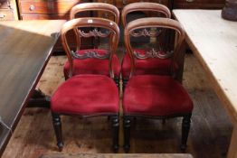 Set of four Victorian mahogany shaped balloon back dining chairs.