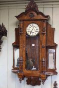 Vienna wall clock in walnut with side mirrors and open quarter shelves, double weight movement,