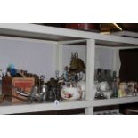 Shelf collection of Meccano with instruction books, metalwares, Meissen candlesticks, glass bottles,