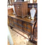 Early 20th Century carved oak sideboard with raise back and twist pillars, 147cm by 152cm.