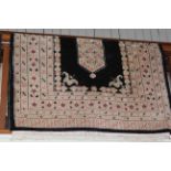 Eastern design rug with a black ground, 1.80 by 1.25.