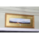 Ben Graham, Cragford, Dartmoor, watercolour, signed lower right, 12cm by 53cm, in gilt glazed frame.