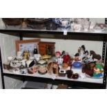 Collection of various china including Royal Doulton character jugs, Melba monkey, money boxes,