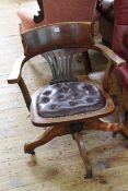 Early 20th Century swivel office armchair with buttoned leather seat.