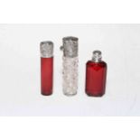 Three small silver mounted scent bottles including late Victorian ruby scent,