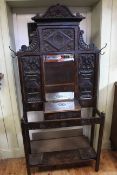 Early 20th Century carved oak mirror back hallstand, 202cm by 92cm.