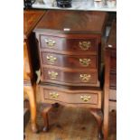 Neat mahogany serpentine front chest of four drawers, 79cm by 40cm.