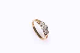 18 carat gold three stone illusion set diamond ring, size N.