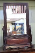 Oriental hardwood table mirror, 81cm by 52cm.