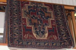 Eastern design rug decorated with wildlife, 2.10 by 1.05.