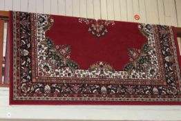 Traditional style carpet with a red ground, 2.90 by 2.00.