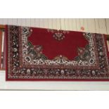 Traditional style carpet with a red ground, 2.90 by 2.00.