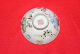 Polychrome Chinese small shallow dish painted and enamelled with artifacts, 9cm diameter.