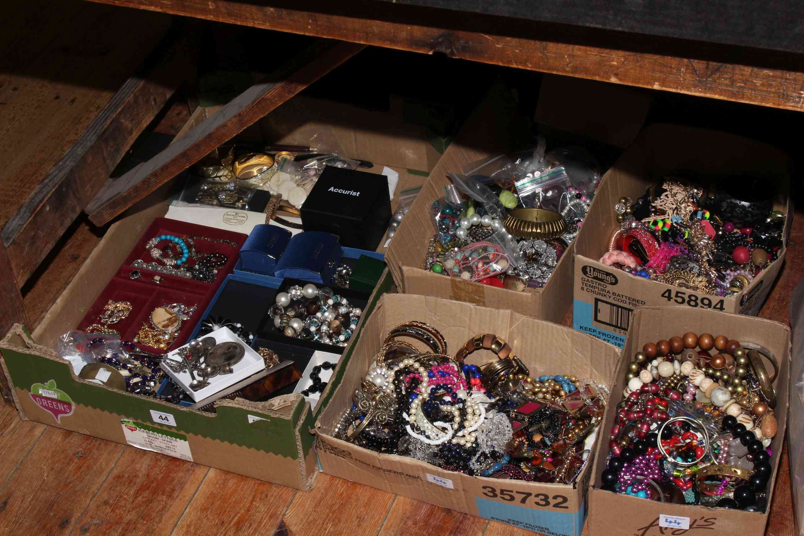 Five boxes of costume jewellery.