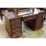 Victorian walnut breakfront nine drawer pedestal desk, 75.5cm by 136cm.