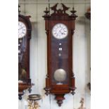 Victorian walnut cased single weight Vienna wall clock, overall length 119cm (no weight).