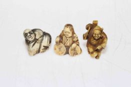 Three Japanese netsuke, one bone and two ivory.