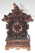 Carved wood mantel cuckoo clock, 54cm high.