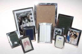 Collection of silver photograph frames.