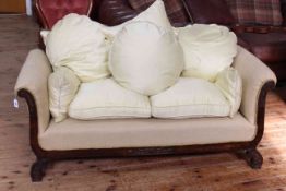 Late 19th/early 20th Century two seater settee on carved feet with extra cushions in lemon fabric.